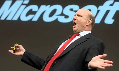 Steve Ballmer on stage with the Microsoft logo in the background.