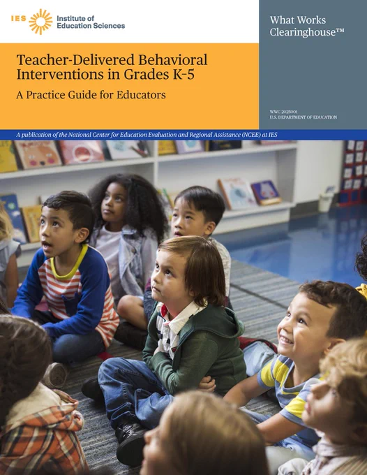 Front page of a WWC practice guide titled "Teacher-Delivered Behavioral Interventions in Grades K-5". Below the title, there is a group of young learners sitting on a carpet in a classroom looking up at an educator.