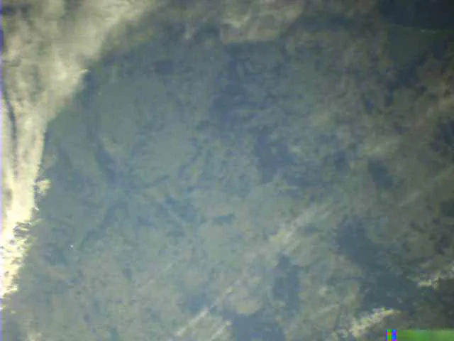 BEESAT-1 Image titled "Warsaw and Poland" taken on 2024-12-13 at 08:09 UTC. The image is mostly cloud free besides a cloudy front on the left border. It shows Poland with the capital Warsaw towards the left of the image.