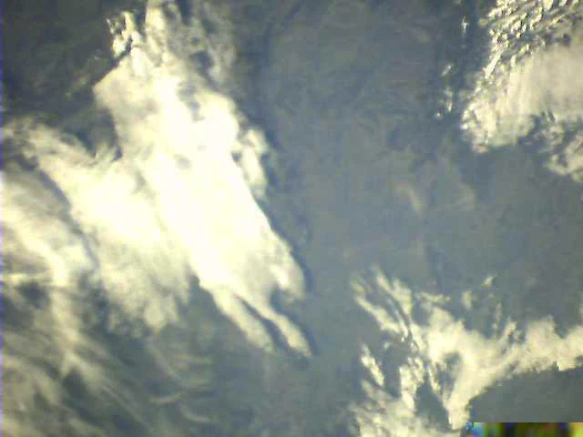BEESAT-1 Image titled "Hungary and Alps" taken on 2024-12-21 at 08:33 UTC. The image shows Hungary from above with the alps in the upper right corner. On the left side a big cloud covers part of the image.