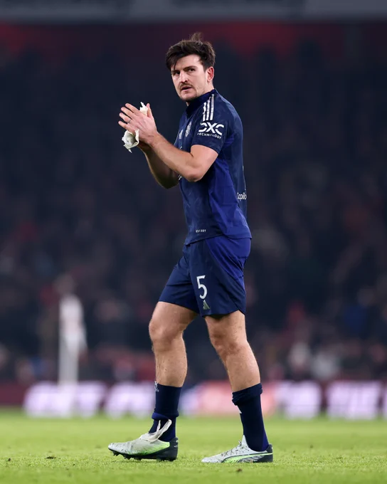 Harry Maguire applauds the away fans during today's game.