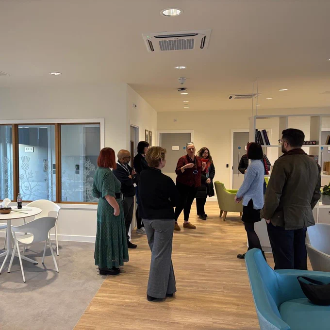 Paul Sweeney MSP being briefed by staff at the Thistle on how the recovery area will work within the overdose prevention centre.