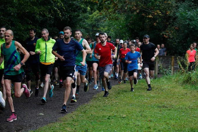 Dozens of runners make their way around the paths at Dinton Pastures