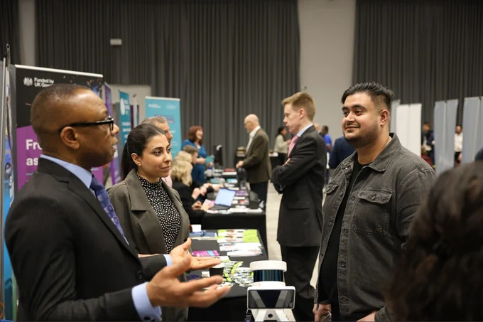 An exhibitor discusses opportunities at Venturefest West Midlands 2024.