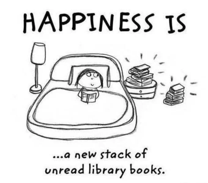 Happiness is a new stack of unread library books.