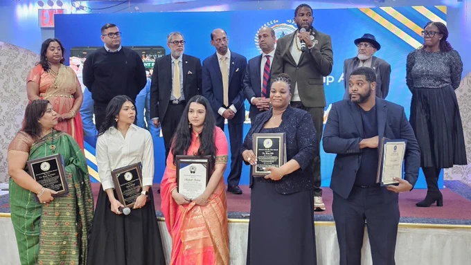The Public Advocate speaks from stage with elected officials and honorees
