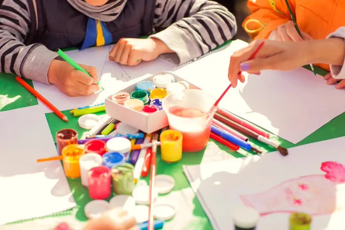Photo of kids working on a painting