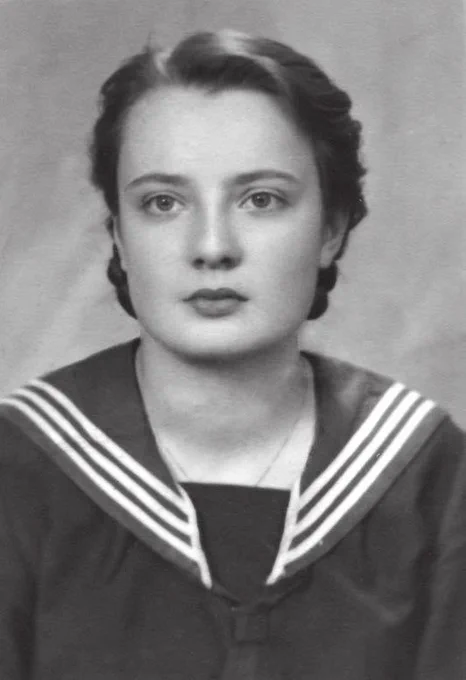 Vintage monochrome portrait of a woman wearing a sailor-style collar outfit.
