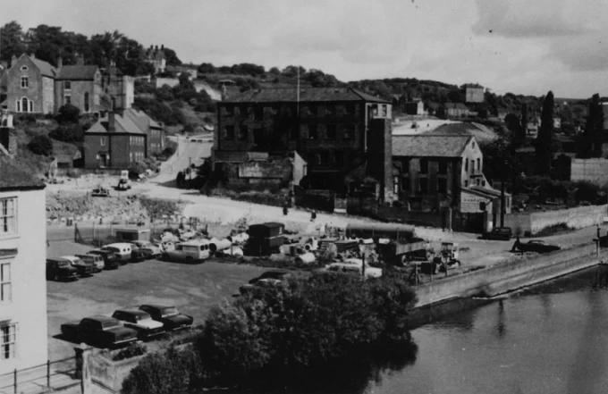 Black and white photograph of old buildings and construction of new roads in Millburngate area of Durham.