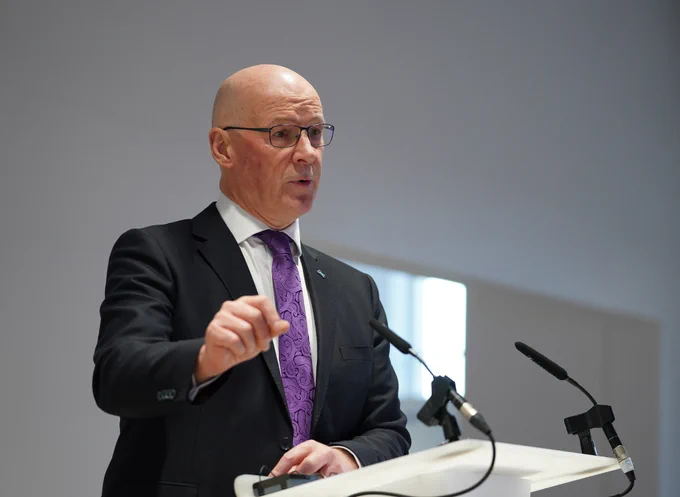 First Minister John Swinney addresses the audience during his speech at the Robertson Trust event in Stirling.