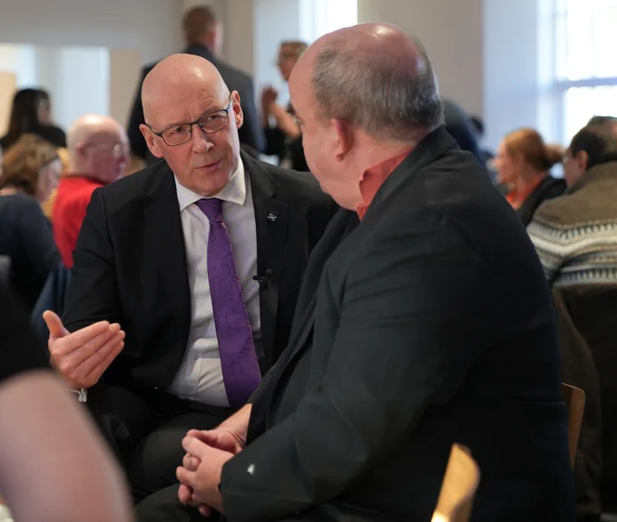 First Minister John Swinney speaks with attendees at Robertson Trust event in Stirling.