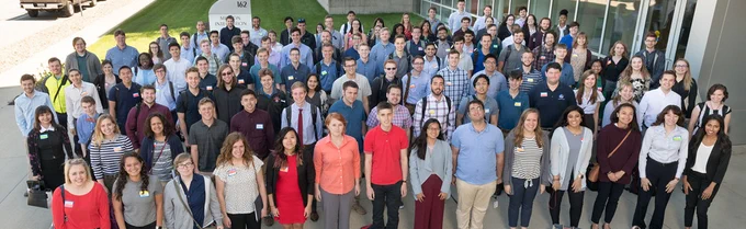 A large group of interns at NASA's Glenn Research Center pose for a photo