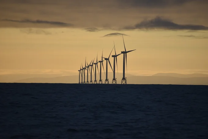 A row of offshore wind turbines.