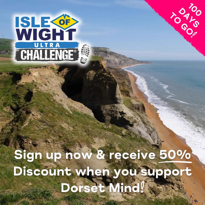 Promotional post for the Isle of Wight Ultra, the photo shows a stunning coastal view, the sea is to the right of the steep cliffes on a sunny day. The IOW Ultra Challenge logo is top left, a pink flash on the right hand corner declares '100 DAYS TO GO!' and the white title says 'Sign up now & recieve 50% Discount when you support Dorset Mind!' 