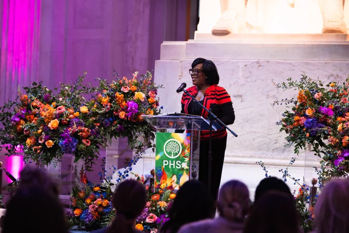Mayor Cherelle L. Parker speaking on stage, behind a podium