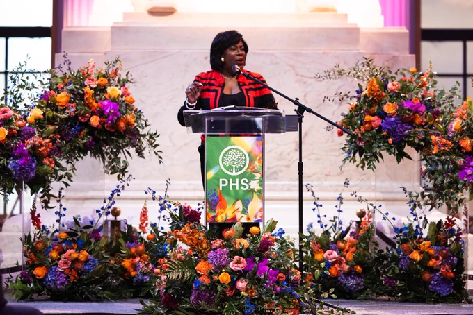 Mayor Cherelle L. Parker speaking on stage, behind a podium