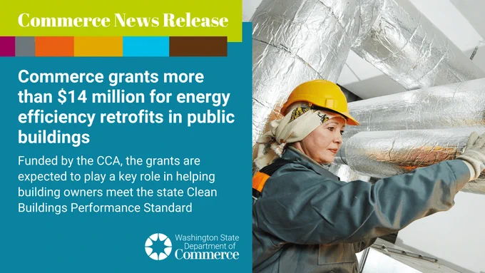 A worker in a hard hat and safety gear inspects ductwork in a building. The image is part of a news release about over $14 million in Commerce grants for energy efficiency retrofits in public buildings, funded by the Climate Commitment Act to assist building owners in meeting state standards.