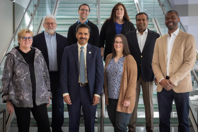Photo: (left to right) Beki Grinter, Tom Conte, David Joyner (back), Vivek Sarkar (front), Elizabeth Cherry (front), Dana Randall (back), Srinivas Aluru, and Olufisayo Omojokun. Photo by College of Computing
