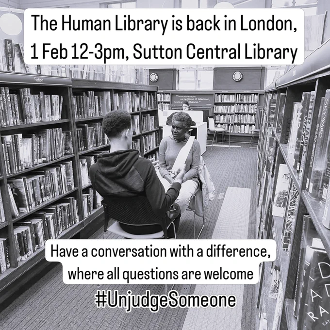 2 people having a conversation in a library