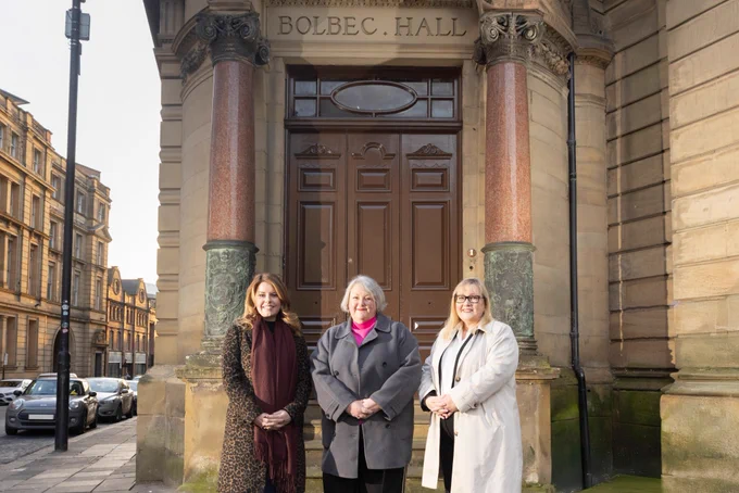 Kim McGuinness, Claire Malcolm and Karen Kilgour standing outside Bolbec Hall. Photo credit: The Bigger Picture