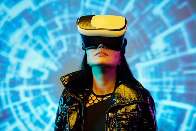 A woman using an AR headset immersed in a digital virtual reality environment.