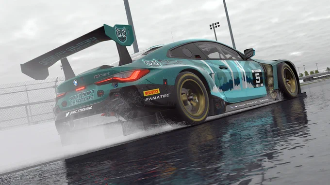 The NSC Racing BMW M4 GT3 is seen here in it's absolute FIRE livery, zooming down a wet track.