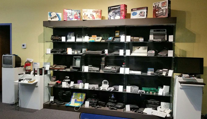 a wall of videogames awaits - more than 30 systems ready for you to learn about their history