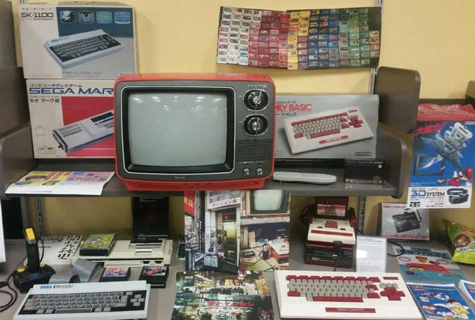 bloop's japan exhibit has sega vs nintendo, japanese edition (pictured are a mark 3 and a famicom with keyboards) and a whole lot more!