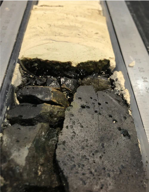 Photograph shows contact between ~12 My old olivine phyric basaltic basement and overlying chalk, cored on crustal V-shaped Ridge 3 and Bjorn drift (395C-U1562A-64X-CC).