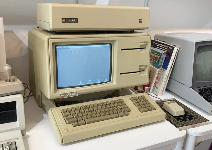 an Apple Lisa with a keyboard, mouse, and ProFile hard drive.