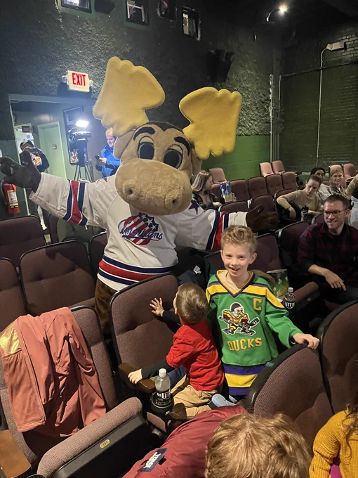 A moose mascot with Mighty Ducks fans