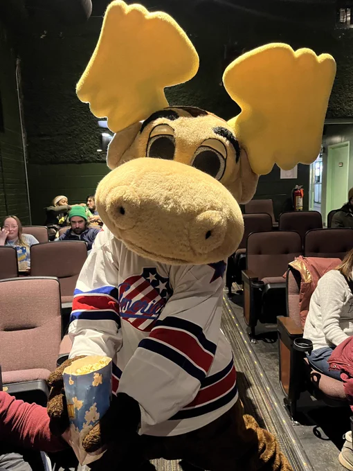 A moose mascot with popcorn