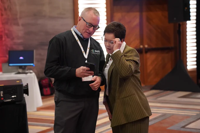 IPSDI CEO John Oates and US Fire Administrator Dr. Lori Moore-Merrell review information on a mobile device.