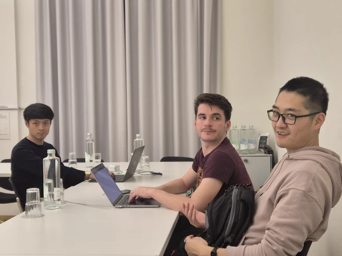 some other participants while working at their laptops.