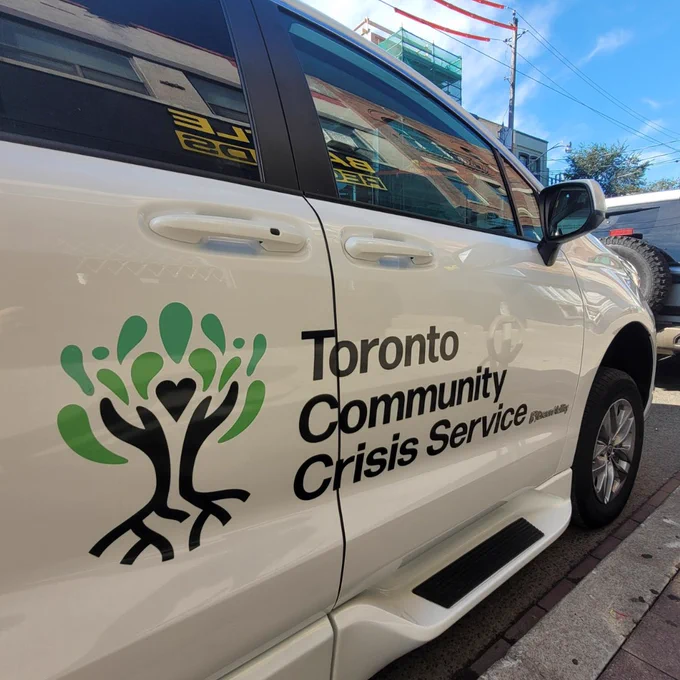 The side of a Toronto Community Crisis Service vehicle.
