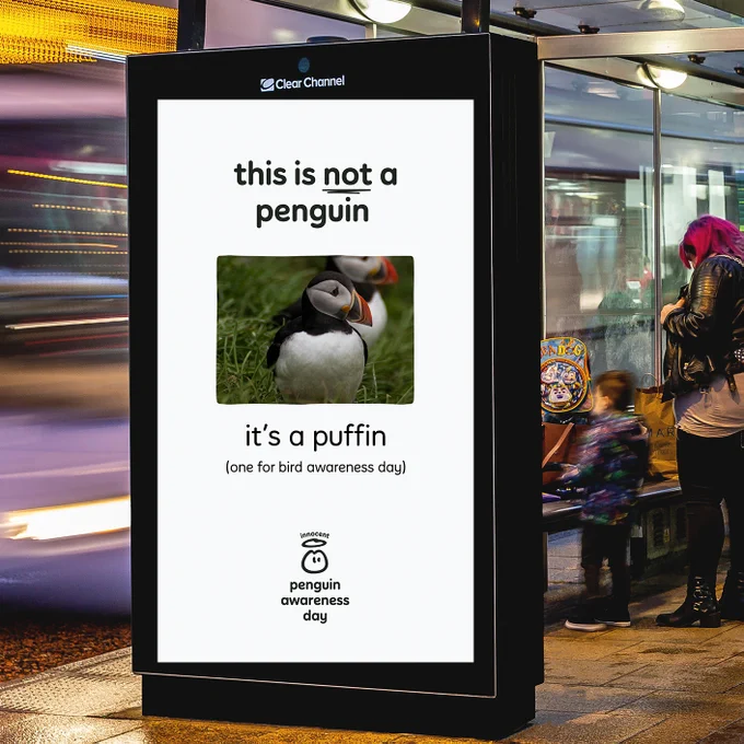 Next, instead of a penguin we've put a puffin on a digital screen outside. We've put 'this is not a penguin, this is a puffin (one for bird awareness day)' below. See what we did there? 