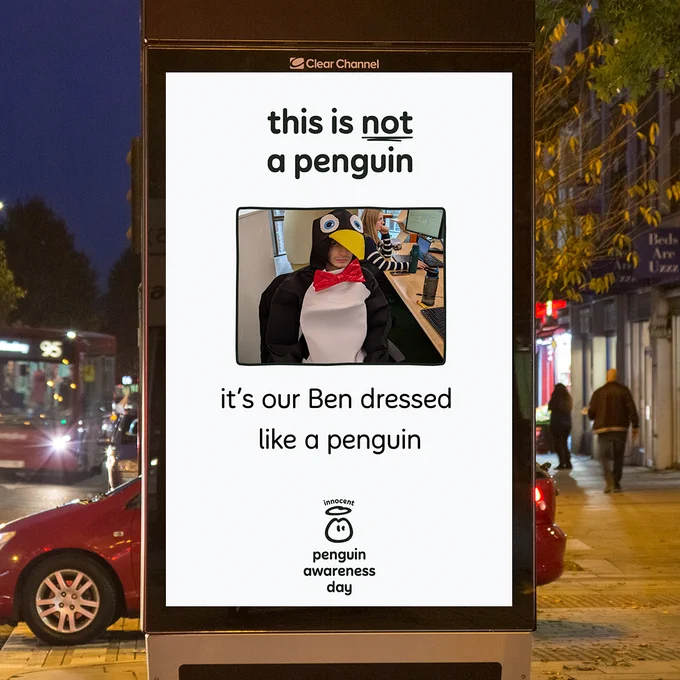 In the final photo, we've got our Ben dressed in a penguin suit. We've put 'this is not a penguin, this our Ben in a penguin suit.' We think he's the best penguin of them all.