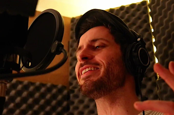 Charlie McCullagh in a recording booth