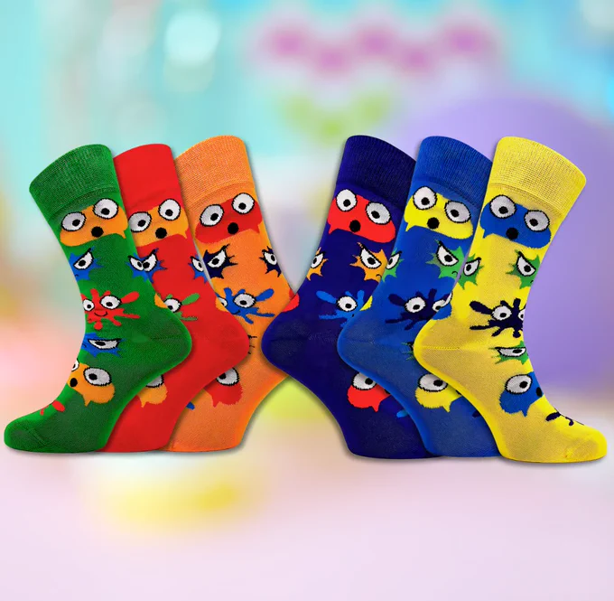 6 World Down Syndrome Day socks in different colours (green, red, orange, purple, blue, yellow) featuring characterized renderings of different emotions