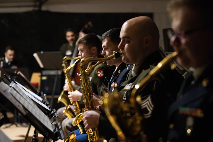 Photo of US Army soldiers playing multiple instruments