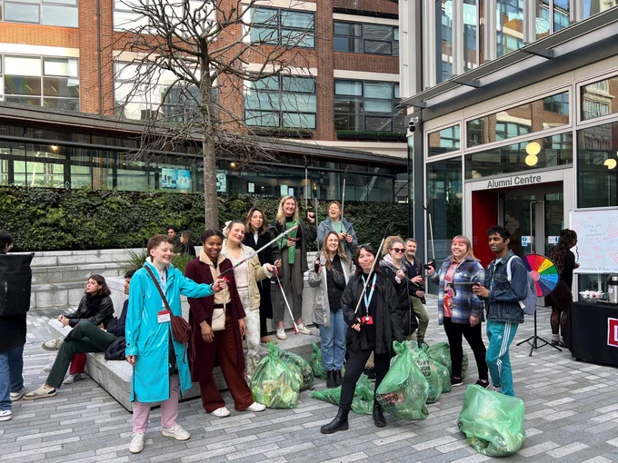 LSE alumni and staff pose for a photograph in the LSE plaza following a litter pick for Global day of Volunteering