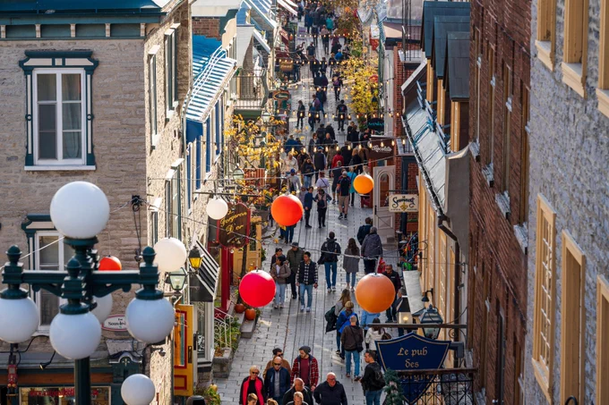 People shopping on the Quartier du Petit Champlain Street in Old Quebec  