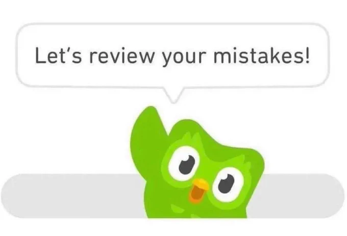 Duo, the green Duolingo owl mascot, saying "Let's review your mistakes!" while waving