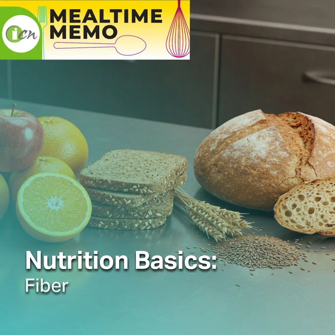 Promotional image for "Mealtime Memo" featuring a variety of fiber-rich foods, including sliced whole grain bread, apples, an orange, and a loaf of bread, arranged on a kitchen counter. Text overlay reads "Nutrition Basics: Fiber.