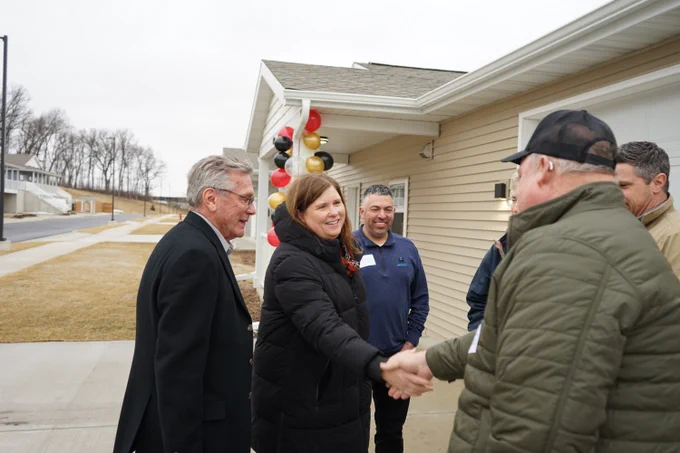 Secretary Kathy Blumenfeld meets with stakeholders of the Dodge County Housing Authority's affordable housing development in the City of Juneau. 