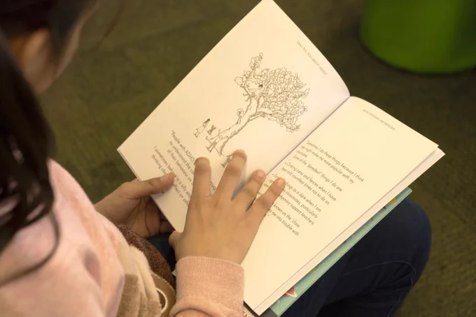 Photo of a child reading a book.