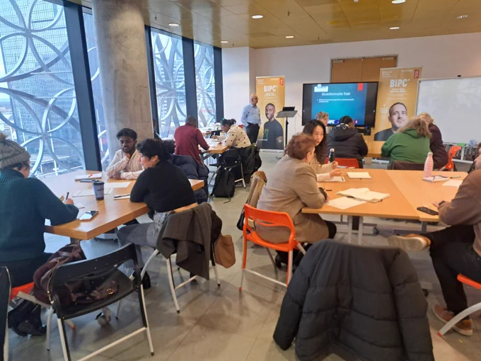 A full house discuss the market research tasks. 