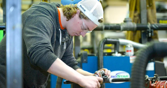 A student working on pipes