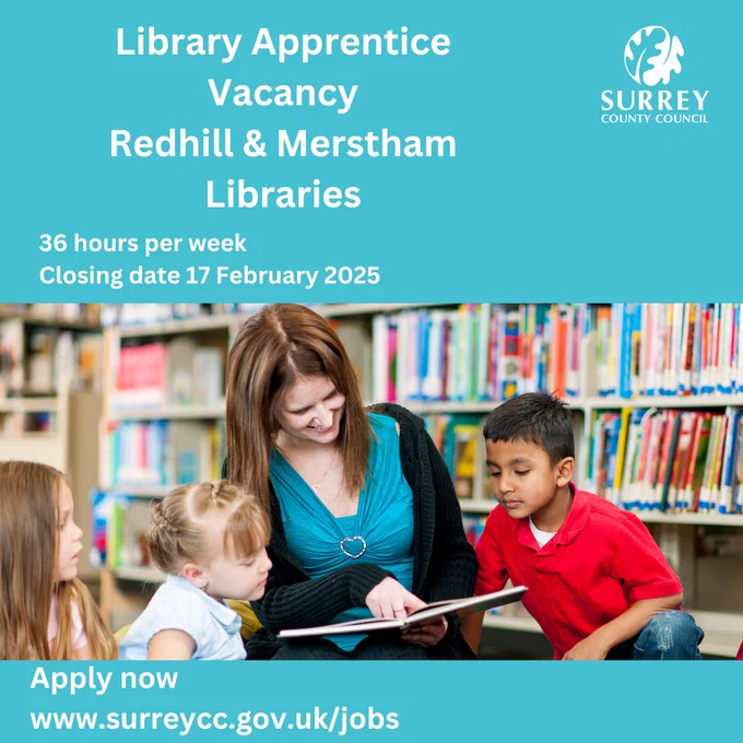 A photo of a woman in a blue top and a black cardigan smiling and pointing at an open children's book, surrounded by three children leaning in to look at the book. In the top right hand corner is the Surrey County Council logo. The text reads "Library Apprentice Vacancy Redhill & Merstham Libraries. 36 hours per week. Closing date 17 February 2025. Apply now  www.surreycc.gov.uk/jobs"