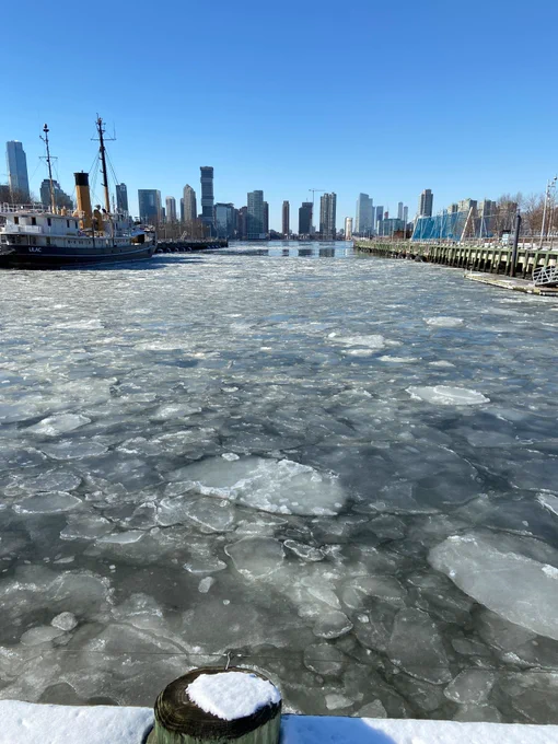 Ice floes of various sizes and opacity float in between Piers 25 and 26 in Tribeca. 